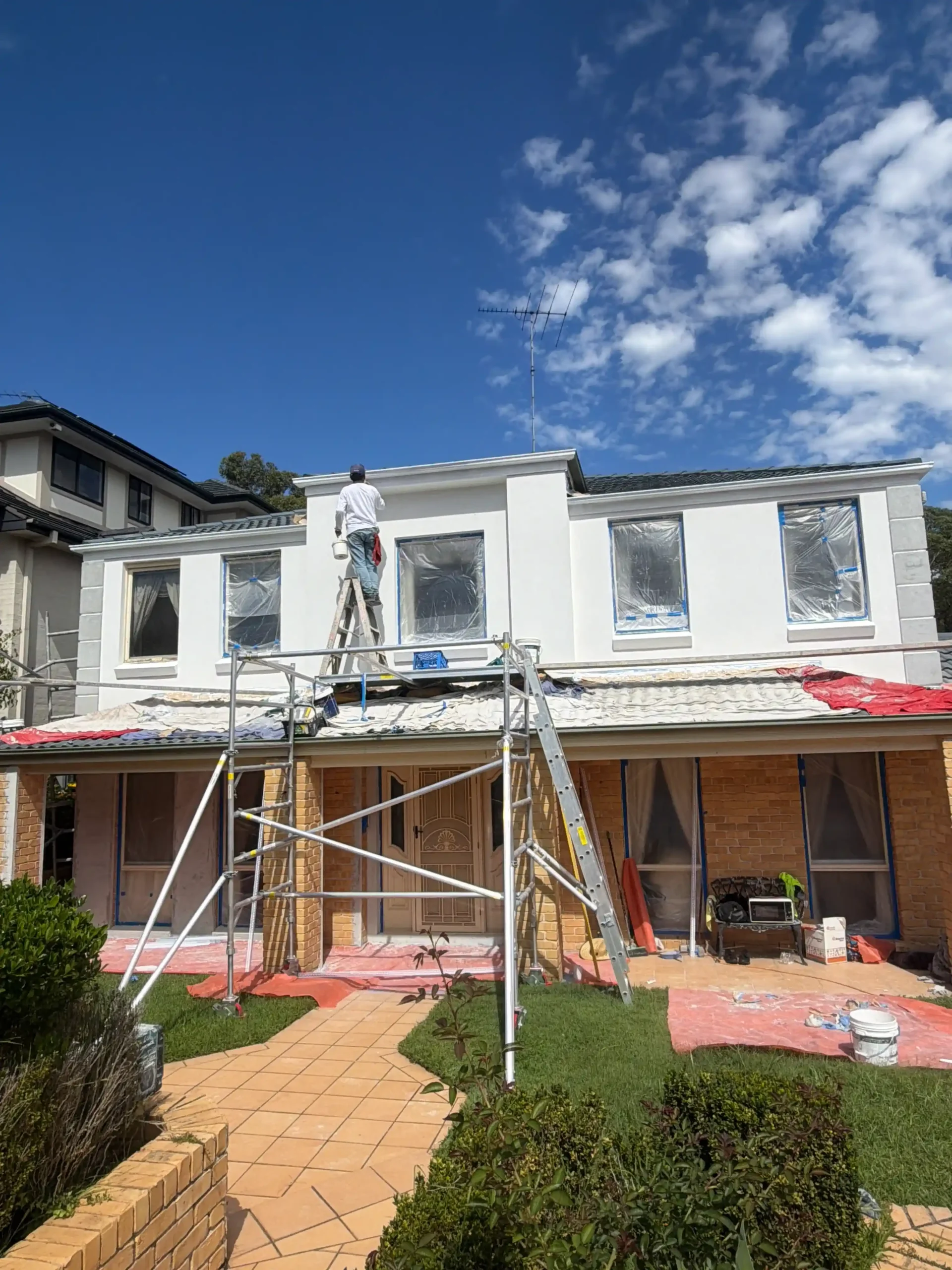 Exterior rendering Sydney house with scaffold and rendered facade work