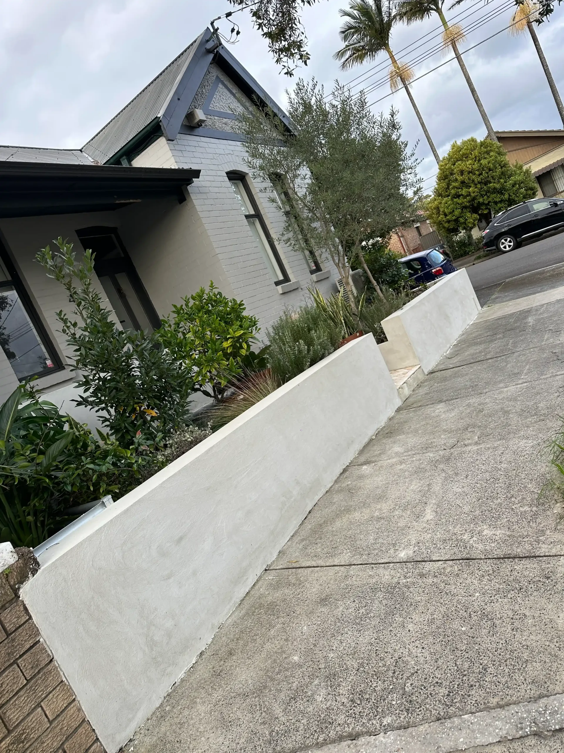Exterior boundary wall rendering Sydney smooth rendered finish